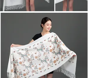 White winter shawl with elegant brown and blue floral embroidery and fringe detail