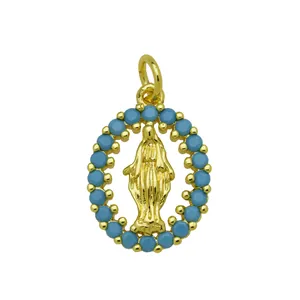 Detailed macro view of 18K gold plated Virgin Mary pendant with blue turquoise-like stones