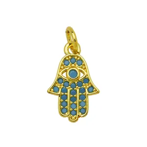 Detailed view of 18K gold plated Hamsa Hand pendant featuring blue turquoise evil eye stones