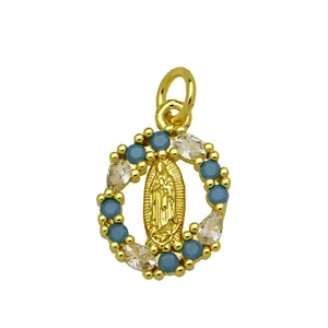Close-up detail of 18K gold plated Virgin Mary pendant featuring blue zirconia stones