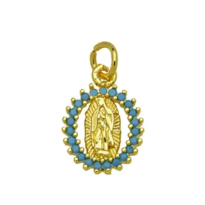 Detailed macro view of Virgin Mary gold plated pendant featuring turquoise-like blue beads