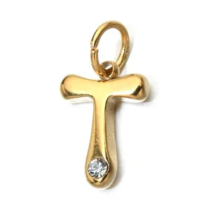Close-up of gold stainless steel letter T pendant with a sparkling birthstone.