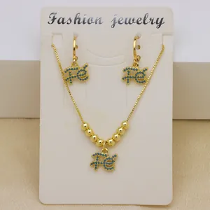 Exquisite 18K gold plated jewelry set featuring blue zircon FE pendants and round beads