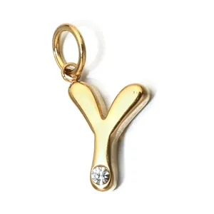 Detailed close-up of gold-plated stainless steel letter Y pendant with sparkling crystal