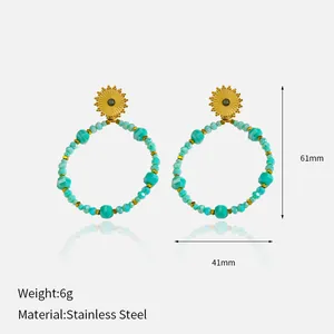 Gold-plated stainless steel earrings with turquoise beads, measuring 61mm by 41mm