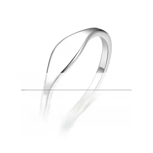 Macro detail of a minimalist stainless steel ring with a smooth wavy design and silver finish
