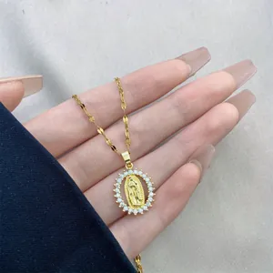 Close-up detail of a luxury gold-plated Virgin Mary pendant necklace with cubic zirconia