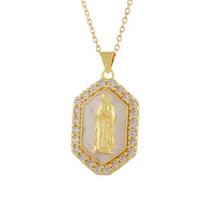 Detailed close-up of gold Virgin Mary relief pendant with shell background and stones.