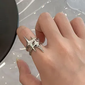Silver spiked star open ring for women, edgy punk style statement jewelry detail view