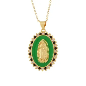 Detailed view of a vintage gold pendant necklace with green enamel and religious relief