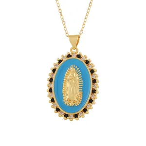 Close-up of a vintage Virgin Mary relief pendant with blue enamel and crystal halo.