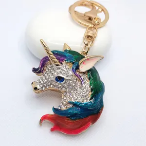 Sparkling rhinestone encrusted unicorn head keychain with colorful enamel mane gold finish