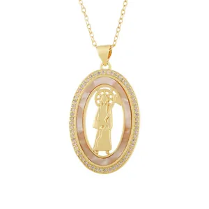 Vintage gold oval pendant necklace featuring Santa Muerte relief and pink shell inlay