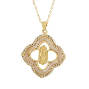 Detail showing the Virgin Mary relief and mother of pearl inlay on gold pendant
