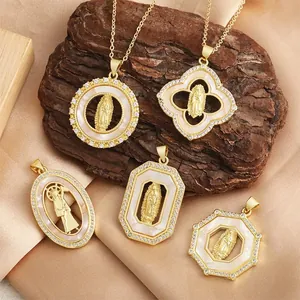 Detailed view of vintage religious embossed pendants with shell inlay and diamond borders.