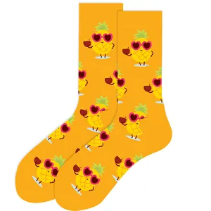 Vibrant yellow crew socks featuring funny cartoon pineapple with sunglasses pattern