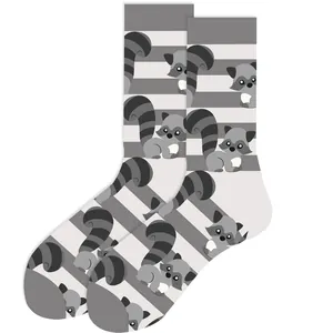 Detailed view of the cute cartoon raccoon pattern on grey and white striped crew socks