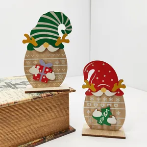 Set of two wooden Christmas gnomes with reindeer antlers and festive hats for holiday decor