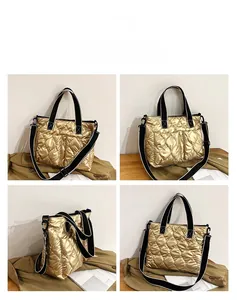 Detailed views of a gold quilted puffer tote bag with wide black shoulder strap.