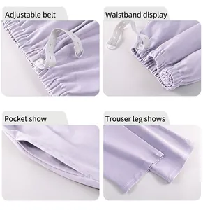 Detail view of soft purple maternity pants with adjustable waistband and side pockets