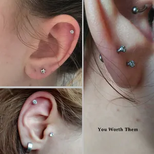 Gedetailleerd overzicht van roestvrijstalen piercingknopjes met ronde en sterzirkonia.
