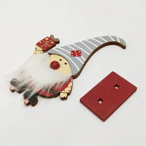 Detailed view of a wooden Christmas gnome ornament with white faux fur beard and base