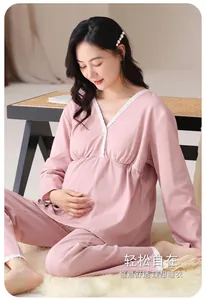 Detail of pink long-sleeved maternity pajama set with lace V-neck and comfy matching pants.