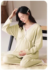 Detail of pale yellow maternity pajama set with V-neck lace trim and soft cotton fabric