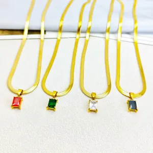Close-up of gold stainless steel blade chains with colorful rectangular zircon pendants.