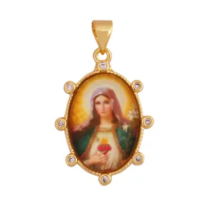 Detailed view of vintage gold plated oval Virgin Mary pendant with sparkling zirconia.