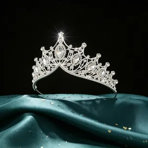 Luxury Baroque bridal tiara featuring marquise crystals displayed on elegant green satin