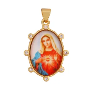 Vintage 18K gold plated brass oval pendant with Virgin Mary icon and clear zircons.