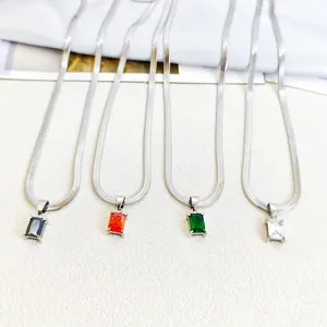 Macro view of four stainless steel blade chains with colored rectangular zircon pendants.