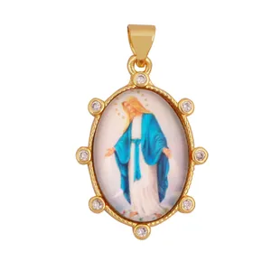 Macro detail view of 18K gold plated Virgin Mary religious pendant with sparkling zircon accents.