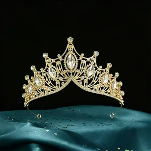 Close-up of a luxurious Baroque bridal tiara with marquise crystals in gold finish