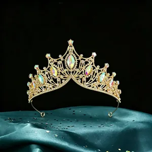 Detailed shot of luxurious gold Baroque bridal crown with marquise iridescent stones