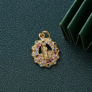 Close-up macro view of gold-plated deity pendant featuring vibrant multi-colored CZ stones