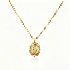 Detailed macro shot of a gold-plated stainless steel oval Virgin Mary pendant necklace