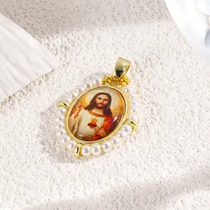 Close-up of elegant gold-plated Jesus pendant with handmade imitation pearl border