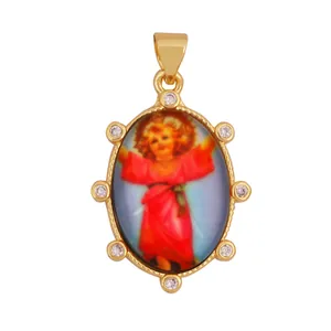 Detailed view of an 18K gold-plated Divine Child pendant with elegant zircon stones border