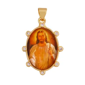 Detailed view of a vintage Jesus Christ pendant in 18K gold plated brass with zirconia.
