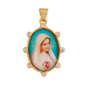 Detailed view of vintage 18K gold plated Virgin Mary pendant with cubic zirconia stones