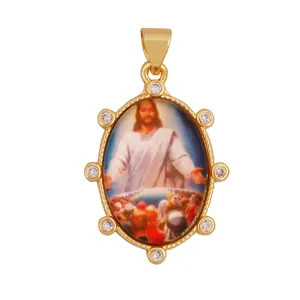 Detailed macro view of 18K gold plated Jesus religious pendant with zircon accents.