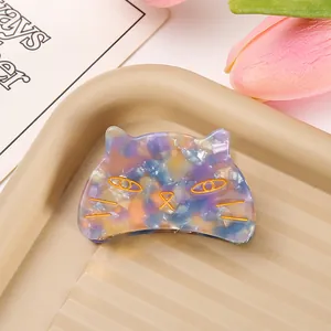 Detailed shot of unique acetate cat hair claw clip with colorful marble pattern
