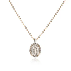 Exquisite detail of silver-tone Virgin Mary pendant with champagne beaded chain necklace