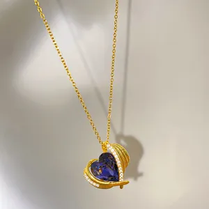 Macro view of the blue faceted heart pendant on a gold-plated steel chain