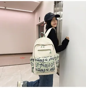 Detail view of the trendy large-capacity student backpack featuring graffiti patterns