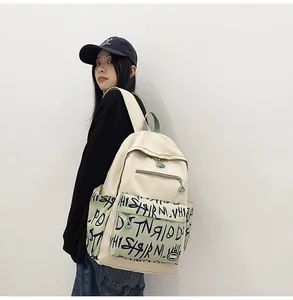Stylish large capacity cream canvas backpack worn by a female model for daily travel