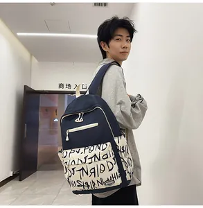Modern graffiti print backpack with large capacity worn by a student in a casual setting