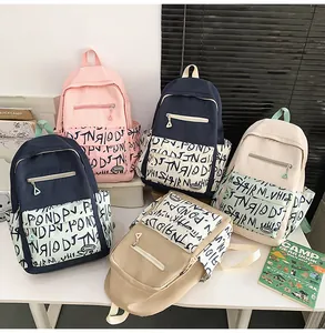 Selection of trendy high-capacity student backpacks in multiple colors with unique graffiti print
